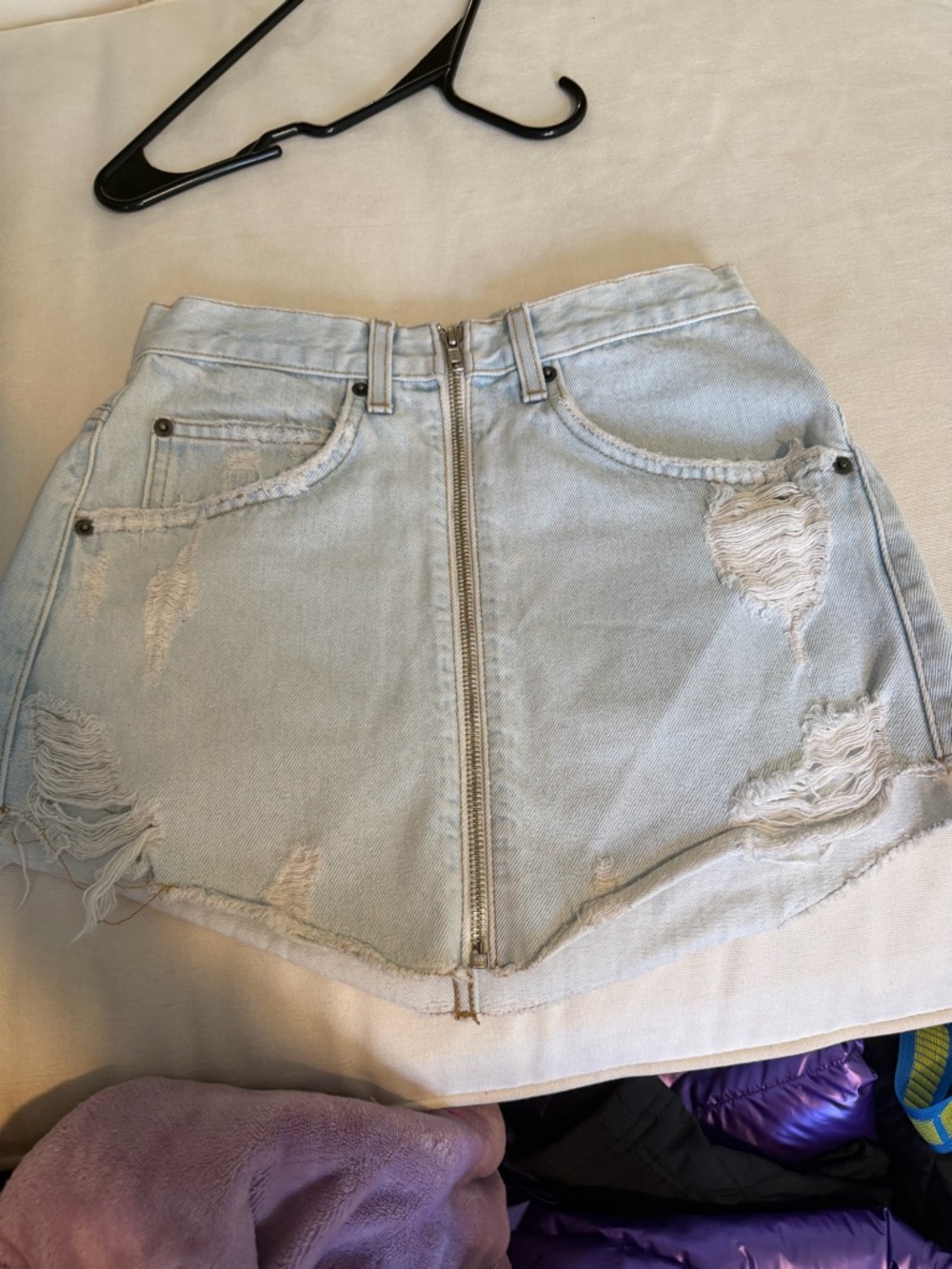 Distressed Light Wash Denim Mini Skirt with Front Zip